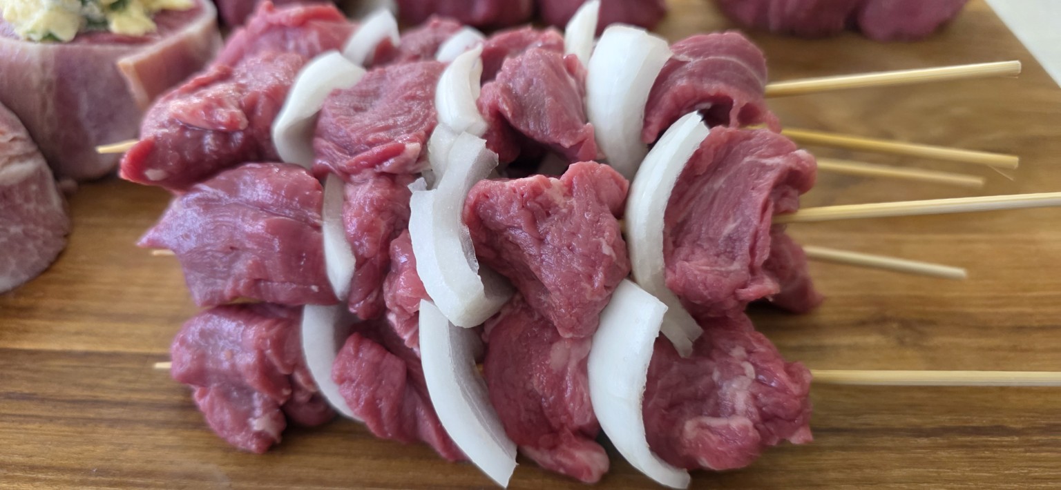 Close-up of beef and vegetable skewers made from cube roll offcuts