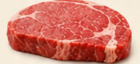 Good beef — bright cherry-red steak with creamy white fat