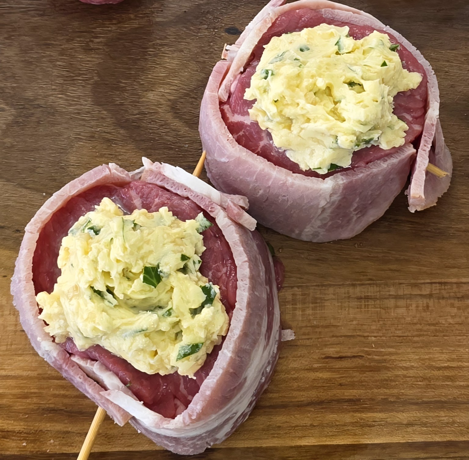 Round cube roll steaks wrapped neatly with bacon