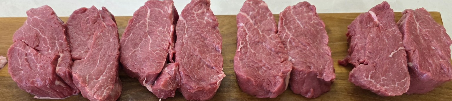 Evenly cut Scotch fillet steaks portioned from a whole cube roll